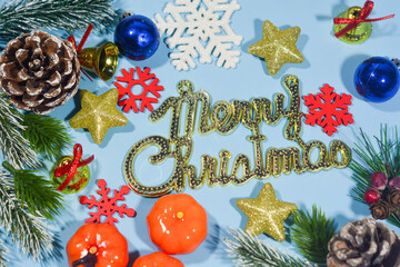 Elegant Christmas background with blue and gold decorations, including baubles, stars, and wrapped...