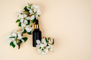 Face Essence on beige Background. Moisturizing Serum for Face Skin. Cosmetics for Skin Care and...