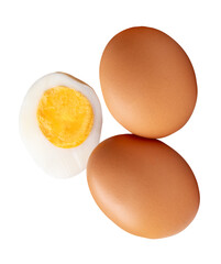 Top view of raw brown chicken eggs and cooked or boiled chicken egg with egg yolk in half isolated with clipping path in png file format