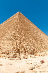 A ruined corner of Egypt's majestic Cheops pyramid under the scorching sun of the Sahara Desert....