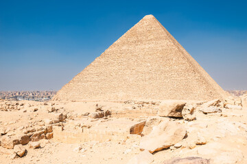 Beautiful majestic Egyptian pyramid of Cheops under the scorching sun of the Sahara desert. Cairo