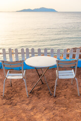 Beautiful romantic sea view from empty table for two at seaside restaurant