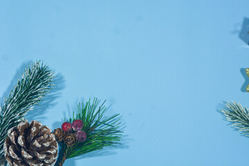 Elegant Christmas background with blue and gold decorations, including baubles, stars, and wrapped...