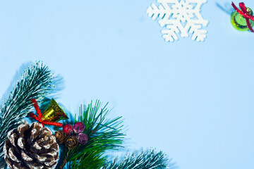 Elegant Christmas background with blue and gold decorations, including baubles, stars, and wrapped...