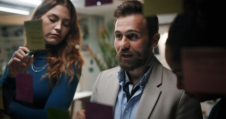 Glass, group and planning for ideas, office and colleagues with marketing strategy, meeting and...