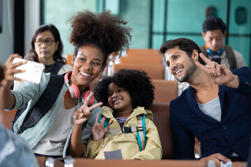 Family Passenger : African American sister and little girl traveling by an airplane. Diverse family travel in summer trip