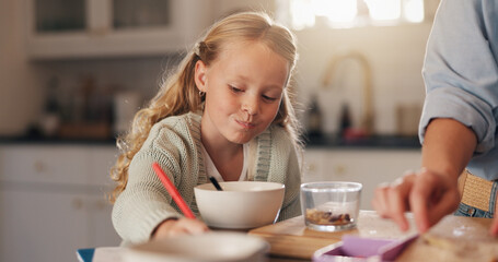 Girl, child and drawing in kitchen at breakfast with parent, help and eating with bonding, care and...