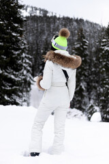 Woman snowboarder on the slopes on a frosty winter day