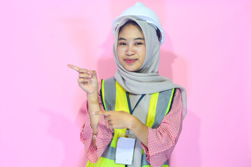 Young Asian woman an attractive young female construction worker working. Carrying a map,...