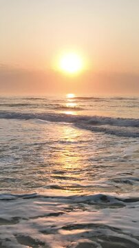 Florianopolis in Santa Catarina during a wonderful sunrise. Mo&ccedil;ambique Beach in aerial view, vertical video.