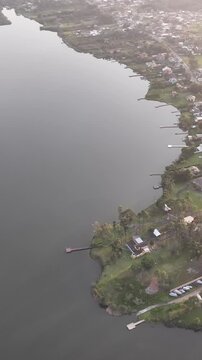 Florianopolis in Santa Catarina during a wonderful sunrise. Mo&ccedil;ambique Beach in aerial view, vertical video.