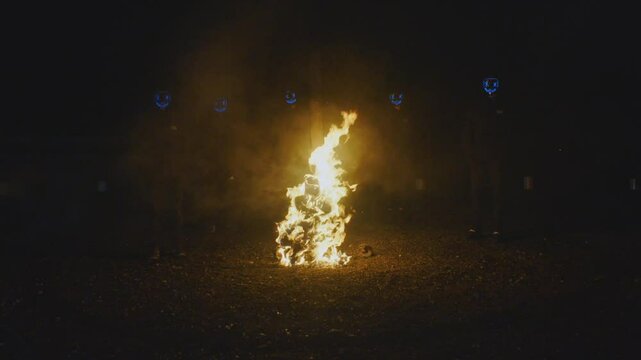 burning witch surrounded by demons