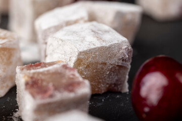Turkish delight with cherry , cubes of Turkish delight with the addition of dried red berries in sugar