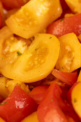 preparation of salad from sliced tomatoes with spices and oil, selective focus, side view