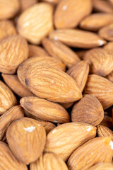 almonds on the table, ready-to-eat almond nuts on a wooden table, close up