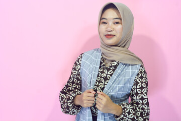 Young Asian woman in casual clothing with a confident body gesture facing the camera