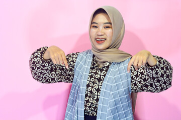 Young Asian woman in casual clothing with a confident body gesture facing the camera