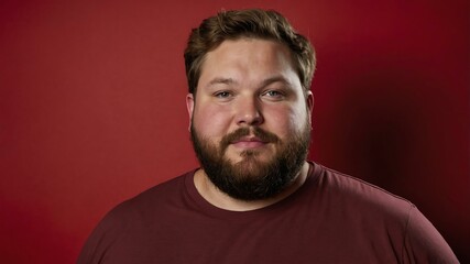 Fototapeta premium Plus size Caucasian man plain red background, looking proud