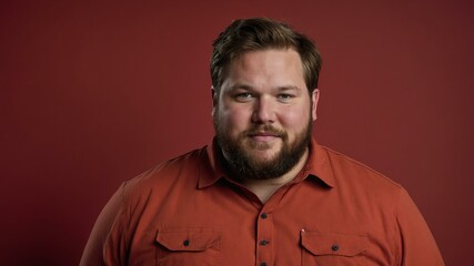 Obraz premium Plus size Caucasian man plain red background, looking proud