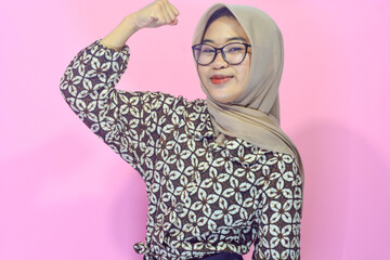 Indonesian Muslim woman with strong body movements who is a young businesswoman