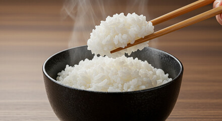 Steaming hot white rice in traditional bowl