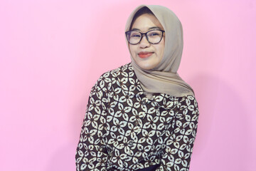 Young Asian woman in casual clothing with a confident body gesture facing the camera