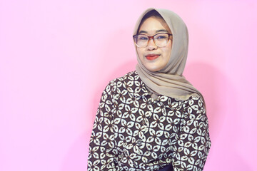 Young Asian woman in casual clothing with a confident body gesture facing the camera