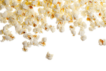 A close up view of popcorn pieces scattered with a black background creating a dynamic food image effect