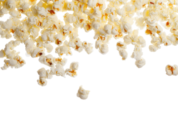 A close up view of popcorn pieces scattered with a black background creating a dynamic food image effect