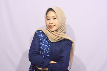 Beautiful young student girl wearing green student t-shirt smiling happily pointing with hand and finger to the side on isolated purple background