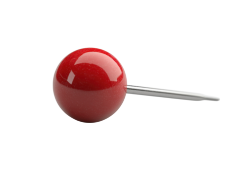 A red ball with a silver pin sticking out of it