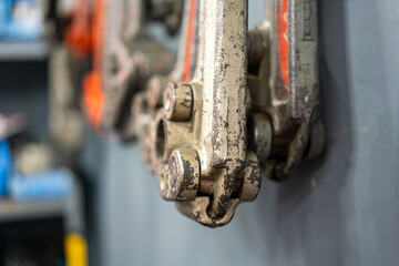 Friction tong or wrench, hand tool for tightenting the pipe that kept in the toolbox. Industrial...