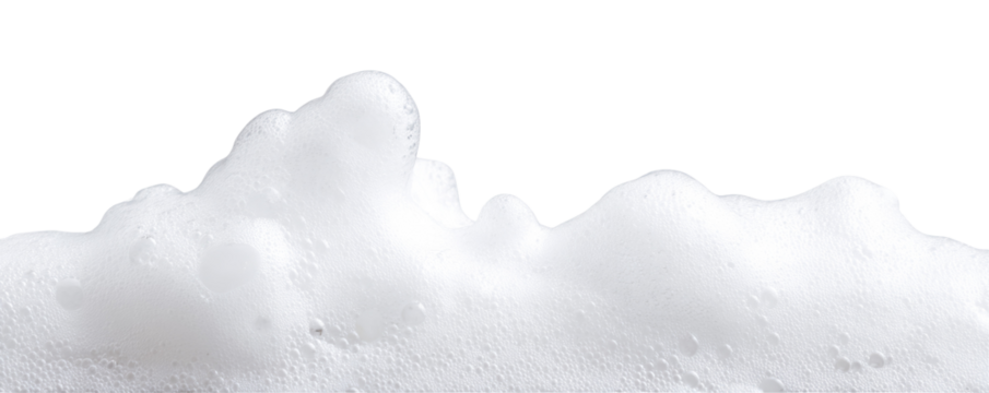 A close up view of a large pile of white fluffy foam against a black background showing texture detail