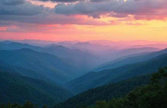 Blue Ridge Mountains at sunset from Blue Ridge Parkway. Amazing nature scenery with layered mountain ranges, green forests, colorful pink, orange sky. Beautiful scenic landscape. Perfect for travel,
