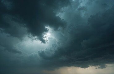 Dramatic dark storm clouds, black sky background. Heavy thunderstorm cloudscape rainy atmosphere, meteorology disaster climate, gloomy cloud sky, strong winds, dangerous weather.