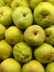 Fresh Yellow Green Pears Stacked in Market
