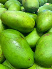 Green Raw Mangoes Displayed in Bulk