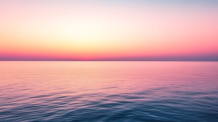 Obraz premium Calm, tranquil ocean at sunrise.