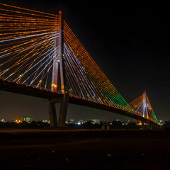 Obraz premium Illuminated Cable-Stayed Bridge at Night: A Stunning Architectural Marvel