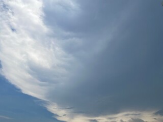 Beautiful round clouds after the rain, under a gloomy sky, big, Soft, round clouds floating in the moody sky 
