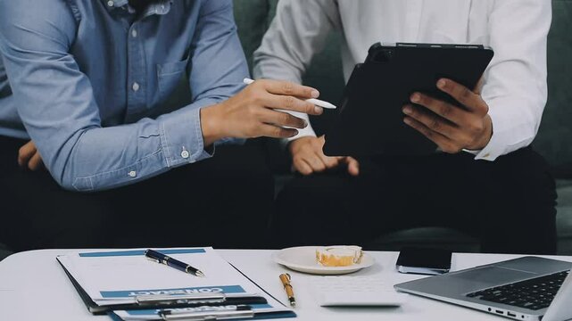 Auditor and accountant team working in office, analyze financial data and accounting record with calculator. Accounting company provide finance and taxation planning for profitable cash flow. Insight - Powered by Adobe