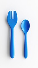 A vibrant blue plastic fork and spoon set against a stark white background.  The utensils are positioned side-by-side, showcasing their simple, child-friendly design