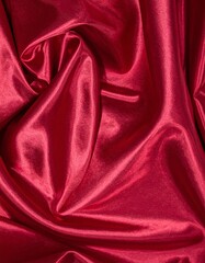 Obraz premium Dark red glossy silk cloth texture close view background
