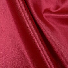 Obraz premium Dark red glossy silk cloth texture close view background