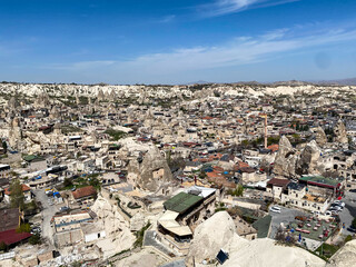  Aerial and panoramic view of cave houses and hotels in Goreme, Cappadocia - the unique natural...