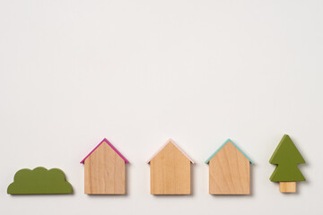 家と樹木のおもちゃでタイトル用のフレーム