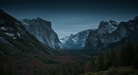 Majestic Mountain Valley at Dusk - Breathtaking view of a snow-capped mountain valley at dusk, with dark blue sky and lush green forest