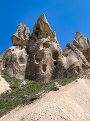 Uchisar Castle or Kalesi, a unique cave building, carved from volcanic rock at the highest point of...