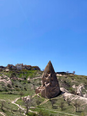 Uchisar Castle or Kalesi, a unique cave building, carved from volcanic rock at the highest point of...