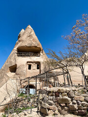 Uchisar Castle or Kalesi, a unique cave building, carved from volcanic rock at the highest point of...